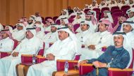 Minister of Municipality and Environment H E Mohamed bin Abdullah Al Rumaihi along with other officials watching the presentation on new Public Hygiene Law at the Ministry headquarters, yesterday.