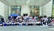 Dr R Seetharaman, CEO of Doha Bank and senior officials of the bank with students and staff members of various schools in Qatar which won the ECO-Schools Programme Awards 2018, yesterday.