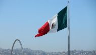 File photo of a Mexican flag seen over the city of Tijuana, Mexico from San Ysidro, a district of San Diego, California, US, April 21, 2017. REUTERS/Mike Blake