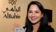 Qatari jewellery designer Leila Abu Issa shows the earrings she designed which will be auctioned at the 15th Doha Jewellery and Watches Exhibition. Pic: Salim Matramkot/The Peninsula