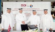 Sheikh AbdulRahman bin Mohamed bin Jabor Al Thani (second right), Chairman of QIMC and Turki bin Mohammed Al Khater (second left), Chairman of UDC shake hands after signing the deal.
