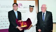 Qatar Chamber board member Ali Abdullatif Al Misnad (centre) with ASMEX President Hassan El Sentissi El Edrissi (right) and Nabi Zniber, Ambassador of Morocco to Qatar while exchanging mementos .