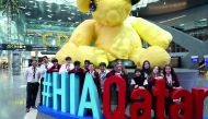Oryx International School Group Photo with the Lamp Bear at Hamad International Airport.