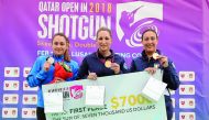 Italian Olympic champions Chiara Cainero (centre) and Diana Bacosi (right) are seen along with France’s Lucie Anastassiou during the victory ceremony at the Losail Shooting Range during the Qatar Open Shotgun Championship.