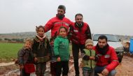Qatar Red Crescent Society (QRCS) volunteers with Syrian children.