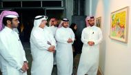 Qatari artist Abdulla Al Kuwari (right) at the opening of “Imaginary Motifs” exhibition yesterday at Fire Station. Pic: Abdul Basit / The Peninsula 