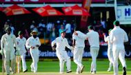 South Africa bowler Kagiso Rabada (4 R) is celebrated by teammates for the wicket of Australia batsman Usman Khawaja during day three of the second Test match between South Africa and Australia at St George's Park in Port Elizabeth, on March 11, 2018. AFP