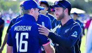 New Zealand's captain Kane Williamson (R) congratulates England's captain Eoin Morgan on their win following the fifth and final ODI cricket match between New Zealand and England at Hagley Oval in Christchurch on March 10, 2018. AFP / Marty Melville