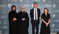 Brigitte Lacombe (second from left) with other officials during the Qumra Talks.