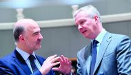 French Finance Minister Bruno Le Maire (R) and European Commissioner for Economic and Financial Affairs, Taxation and Customs Pierre Moscovici attend an Economic and Finance ministers meeting (ECOFIN) in Brussels on March 13, 2018. AFP / Emmanuel Dunand