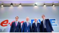 Rolf Martin Schmitz (2nd R), chairman of German energy supplier RWE, RWE CFO Markus Krebber (R), Johannes Teyssen (2nd L), CEO of German utility company EON, and EON CFO Mark Spieker (L) pose at the beginning of a joint press conference on March 13, 2018 