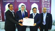 Mohammad Al Hasel Al Yafei receives the best photo award at the tenth annual Arab Tourism Media Oscar Awards.