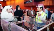 Minister of Education and Higher Education H E Dr Mohammed Abdul Wahed Ali Al Hammadi and Assistant Under-Secretary for Educational Affairs Fawziya Al Khater visiting one of the stalls during the Qatar National Robot Olympiad.