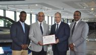 R K Murugan, AAB’s Acting CEO & COO - Automotive Division; Imad Hamzeh, Real Estate Director, pose with the award. 