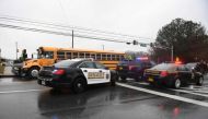 Sheriffs and Maryland State Troopers gather on March 20, 2018 at Great Mills High School in Great Mills, Maryland after a shooting at the school. AFP / JIM WATSON
