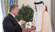 Emir H H Sheikh Tamim bin Hamad Al Thani with President of the Republic of Ukraine Petro Poroshenko, at the Emiri Diwan yesterday.