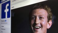 A picture taken in Moscow on March 22, 2018 shows an illustration picture of the Russian language version of Facebook about page featuring the face of founder and CEO Mark Zuckerberg.  AFP / Mladen Antonov