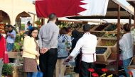 People flock a stall selling locally grown ornamental plants at Mahaseel Souq which concludes today at the Southern area of Katara. 