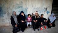 Relatives of a Palestinian, who was killed along Israel border with Gaza, react at a hospital in the central Gaza Strip April 3, 2018. Reuters/Suhaib Salem


