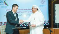 Abdulla Al Mansoori (right), Director, Qatar Career Development Center, and Dr  Donald Francis, Director, Awsaj Academy, during the  MoU signing ceremony.