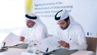 Omran Al Kuwari, Acting CEO, Executive Director-CEO Office, QF, and Yousuf Mohamed Al Jaida, CEO, QFCA, at the signing event.