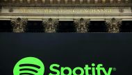 The Spotify logo hangs on the facade of the New York Stock Exchange as the company lists its stock with a direct listing in New York, U.S., April 3, 2018. Reuters/Lucas Jackson