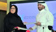 Amal Abdullatif Al Mannai (left), CEO of Qatar Foundation for Social Work, and Mohammed bin Khalifa Al Suwaidi, CEO of Aspire Zone Foundation, during the signing ceremony at Torch Hotel, yesterday. Pic: Baher Amin / The Peninsula