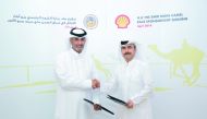 Officials exchanging documents after signing the Shell’s three-year sponsorship agreement of Emir’s main camel race.