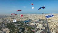 Skydive Qatar Chairman, Sheikh Abdulaziz bin Ahmed bin Khalifa Al Ahmad Al Thani, jumps from a copter revealing a huge banner carrying the bowel cancer awareness tagline ‘Don’t wait for symptoms’.