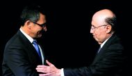 Brazil's new Finance Minister Eduardo Guardia is congratulated by his predecessor Henrique Meirelles during the handover ceremony for the new Financial Minister in Brasilia, Brazil April 11, 2018. Reuters/Adriano Machado