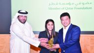 Georgetown University in Qatar’s (GU-Q), Yoonsuk Choi and Fatima Farooqui receiving the title.