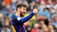 Barcelona's Argentinian forward Lionel Messi thumbs up during the Spanish league footbal match between FC Barcelona and Valencia CF at the Camp Nou stadium in Barcelona on April 14, 2018. / AFP / LLUIS GENE