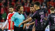SC Freiburg's Robin Koch speaks with referee Guido Winkmann after a penalty is awarded to Mainz REUTERS/Kai Pfaffenbach 
