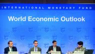 Maurice Obstfeld (2nd R), Economic Counsellor and Director of the Research Department at the IMF; Gian Maria Milesi-Ferretti (2nd ), Deputy Director of the Research Department at the IMF; Malhar Nabar (L), Deputy Division Chief of the Research Department 