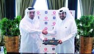 Sheikh Hamad Abdulla Jassim Al Thani (left), CEO, Vodafone Qatar; and Nabeel Al Buenain, CEO of Qatari Diar Real Estate Investment Company, shake hands after signing the agreement.