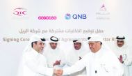 H E Sheikh Abdullah bin Nasser bin Khalifa Al Thani (second left), the Prime Minister and Interior Minister; and H E Jassim bin Saif Al Sulaiti (second right), Minister of Transport and Communications; look on as  Ali Ahmed Al Kuwari (right), QNB Group Ch