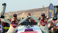 Qatar’s Nasser Saleh Al Attiyah and his French navigator Matthieu Baumel celebrate on the podium after winning the Jordan Rally at Dead Sea, Jordan yesterday.