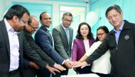 Officials cutting a cake at the inauguration ceremony.