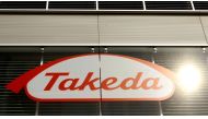 FILE PHOTO: The logo of Japanese Takeda Pharmaceutical Co is seen at an office building in Glattbrugg near Zurich March 7, 2012. REUTERS/Arnd Wiegmann/File Photo