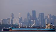 Oil tankers pass the skyline of Singapore,  June 8, 2016. (Reuters /Edgar Su) 