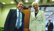 IMF Managing Director Christine Lagarde poses for a photo with Argentinian Economy Minister Nicolas Dujovne prior to talks at IMF headquarters in Washington, DC, on May 10, 2018. AFP / Nicholas Kamm