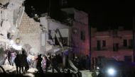 Civil defence crews and locals conduct search and rescue works after a bomb laden car explodes in front of the district hospital near the court house in Idlib, Syria on May 12, 2018. At least 12 people died and 25 injured. Khalaf Joumaa - Anadolu 