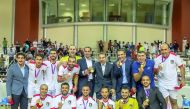 The Jordanian players and officials pose for a group photo. 