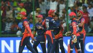 Delhi Daredevils cricketer Sandeep Lamichhane (3R) celebrates the wicket of Mumbai Indians cricketer Krunal Pandya with teammates during the 2018 Indian Premier League (IPL) Twenty20 cricket match between Delhi Daredevils and Mumbai Indians at the Feroz S