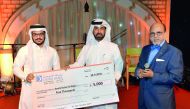 Dr R Seetharaman (right), CEO of Doha Bank and Rashid Al Mansoori (centre), CEO, Qatar Exchange; with one of the winners of Doha Bank’s Al Dana programme during the special Suhoor banquet hosted for the bank’s corporate clients and customers at the Fawane
