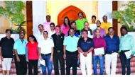 Golf enthusiasts who underwent a two-month coaching camp pose for a group picture.