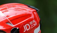 FILE PHOTO: A logo of JD.com is seen on a helmet of a delivery man in Beijing, China June 16, 2014. Picture taken June 16, 2014. REUTERS/Jason Lee/File Photo