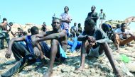 Migrants wait to be transported to a detention center, at the coast of Tajoura, east of Tripoli, Libya June 20, 2018. Reuters/Hani Amara