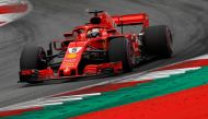 FILE PHOTO - Ferrari's Sebastian Vettel in action during qualifying REUTERS/Leonhard Foeger
