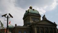 A surveillance camera (CCTV) of the Swiss National Bank (SNB) is pictured in front of the Swiss Federal Palace (Bundeshaus) in Bern, Switzerland, July 2, 2018. Reuters/Denis Balibouse

